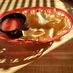 a plate of chips and salsa