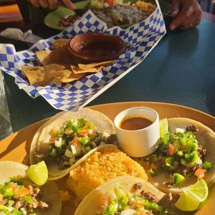 Carne asada tacos and Enchiladas verdes
