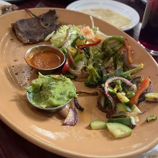 Parrillada for two, a joke! 3 small dry pieces of meat, 3 tortillas, bad is not enough! DONT WASTE YOUR MONEY HERE!