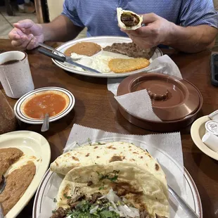 a man eating a burrito