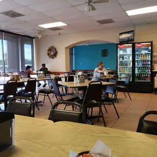 a restaurant with tables and chairs