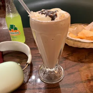 a chocolate milkshake and a cup of coffee