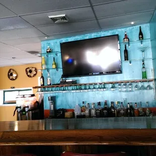 a bar with a television on the wall