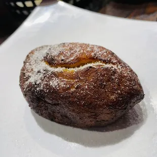 a pastry with powdered sugar on top