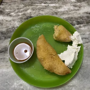 Chicken empanadas, I added sour cream at home.