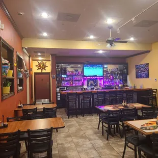 Middle section of the dining area plus the bar