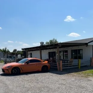 a car parked in front of a restaurant