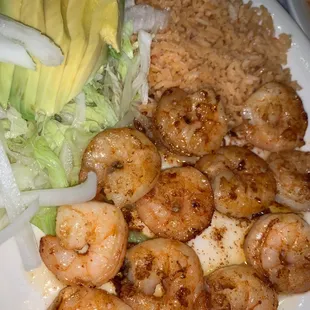 a plate of shrimp and rice