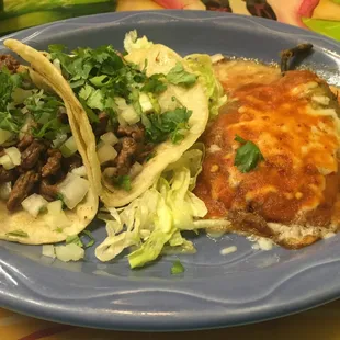 two tacos on a blue plate