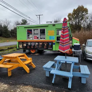 the food truck and picnic tables