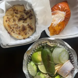 My order! Pupusa de revuelta along with three tacos. Loved the slice of charred jalapeño pepper and the sauces that came with it!