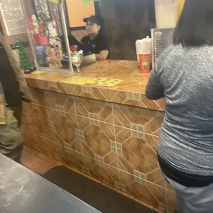 Miserable cashier, who clearly has no customer service skills. And making a burrito is a hard job.