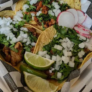 Carnitas, al pastor, and chicken street tacos