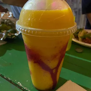 Mangonada from a guy selling them and fruits from the back of his pickup truck next to the restaurant