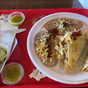 Two shredded beef, tacos, and extra beans instead of rice and the green sauce is wonderful.