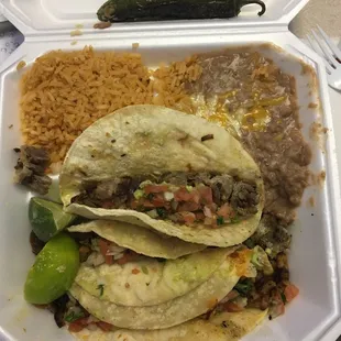#3 combo meal  comes with 2 tacos, rice and beans. I added an extra taco.