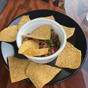 Starter chips and chopped peppers with lime juice.