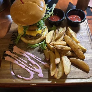 Regular cheeseburger with potato wedges.