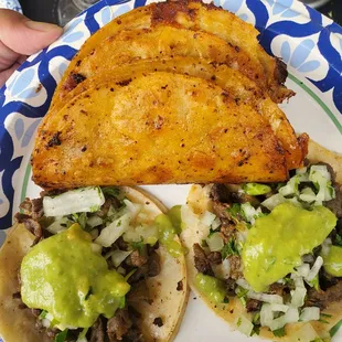 Two quesabirrias and two beef tacos