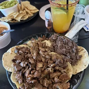 Barbacoa, bistec and tripitas  Mango margarita  Guacamole and chips