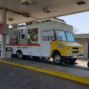 a food truck at a gas station