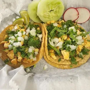 two tacos on a table