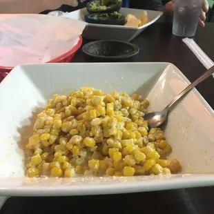 A lovely half-eaten serving of Taco Felíz's  elote "Mexican Corn" (by the time I remembered to take a photo, I'd already eaten most of it!)