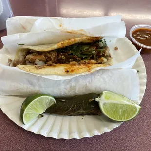 3 tacos, carnitas, pastor, and chorizo.