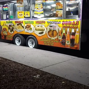 a food truck parked on the side of the road