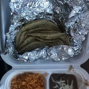 a meal in a styrofoam container