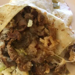 Asada burrito. Steak is seasoned very well.