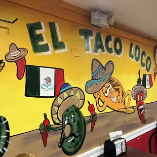 a mural on the wall of a mexican restaurant
