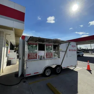a food truck at a gas station