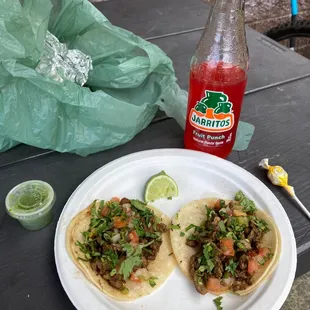 two tacos and a bottle of soda