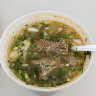 Caldo De Pollo O Res soup with red onion, cilantro, jalapeños, lime juice mixed in