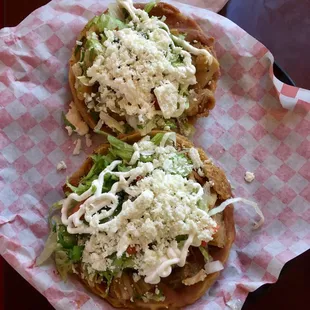 Sopes de tripa. Amazingly crisp tripe piled on with beans, crema lettuce and cheese. The sopes themselves are larger than most . . .