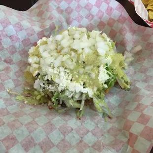 Sope de barbacoa topped with guacatillo salsa