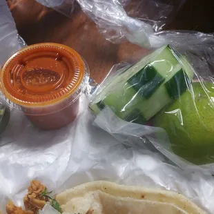 Cucumber, lime,  radishes, and sauce on the side