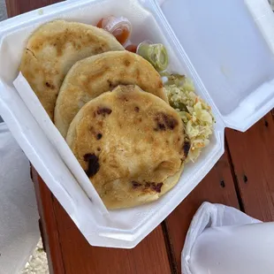 Pupusas de chicharron with salsa rojo y verde (red and green salsa)