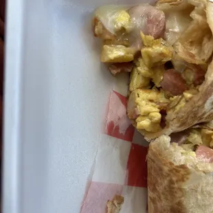 a breakfast burrito on a plate