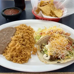 2 flour supreme (beef) tortilla special with rice and beans. Chips and salsa too!