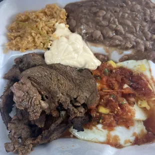 Steak and eggs with rice and beans