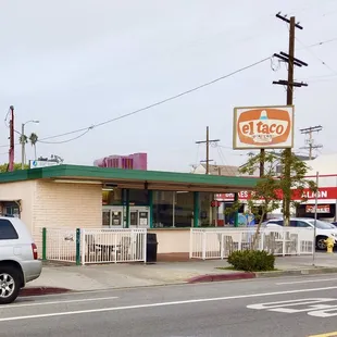 a car parked in front of a restaurant