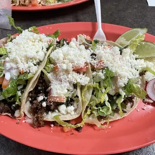 Three carne tacos all the way