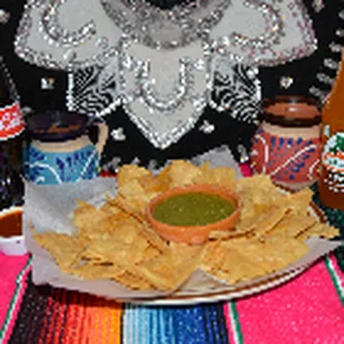 a plate of chips and salsa