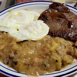 Steak and eggs with smothered potatoes