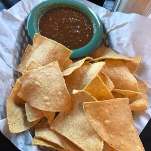 Chips and salsa. Spicy salsa, chips .