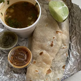 Carne asada burrito with side of consume