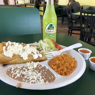 Flautas meal with lime Jarritos.