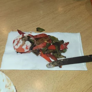 These are the added vegetables that I asked her not to put in my fajitas because I am allergic to bell peppers